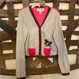 cardigan sweater with cute dog with glasses by one of the pockets.